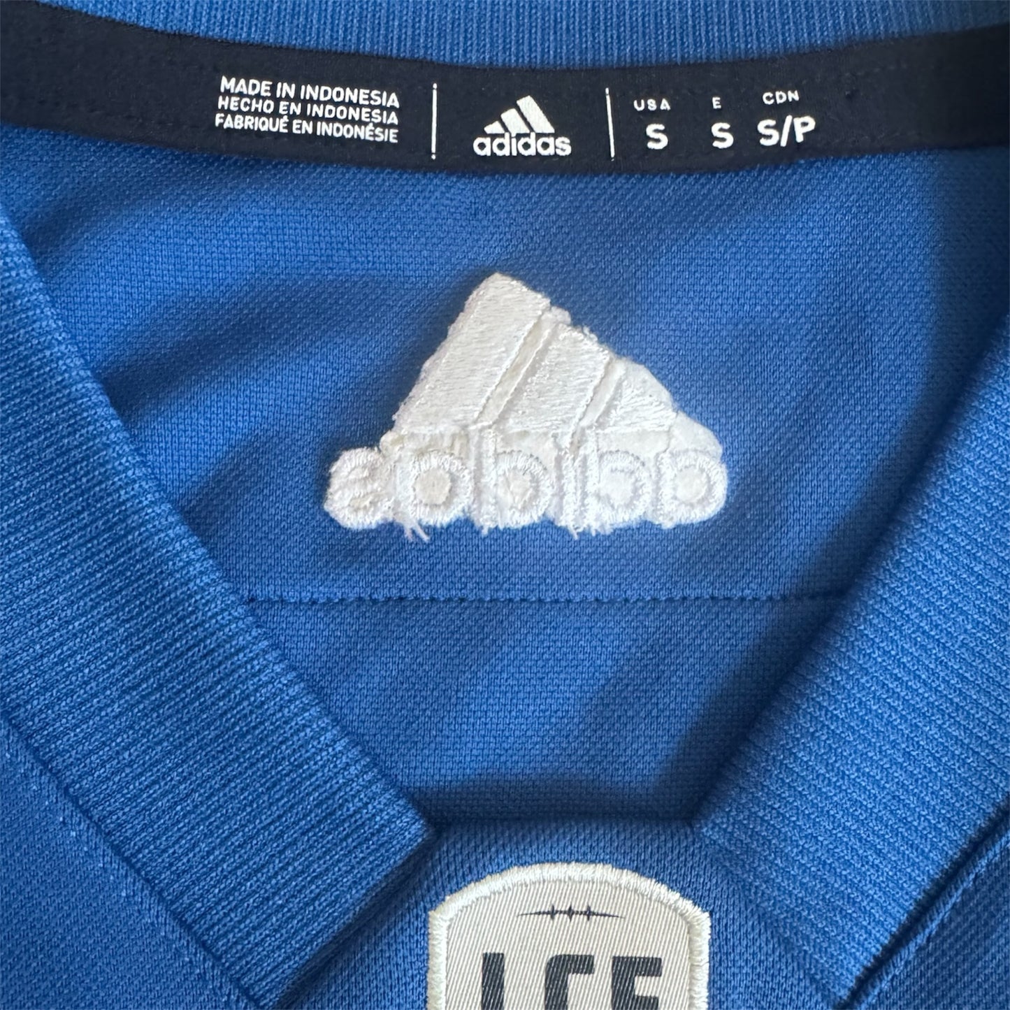 Montreal Alouettes Adidas CFL home jersey, size tag close-up